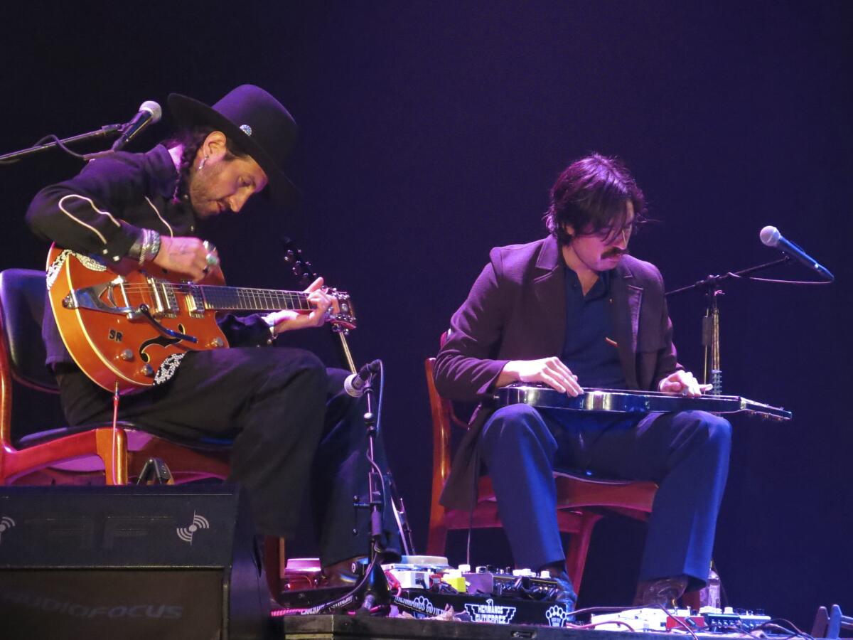 Hermanos Gutierrez performing live on stage